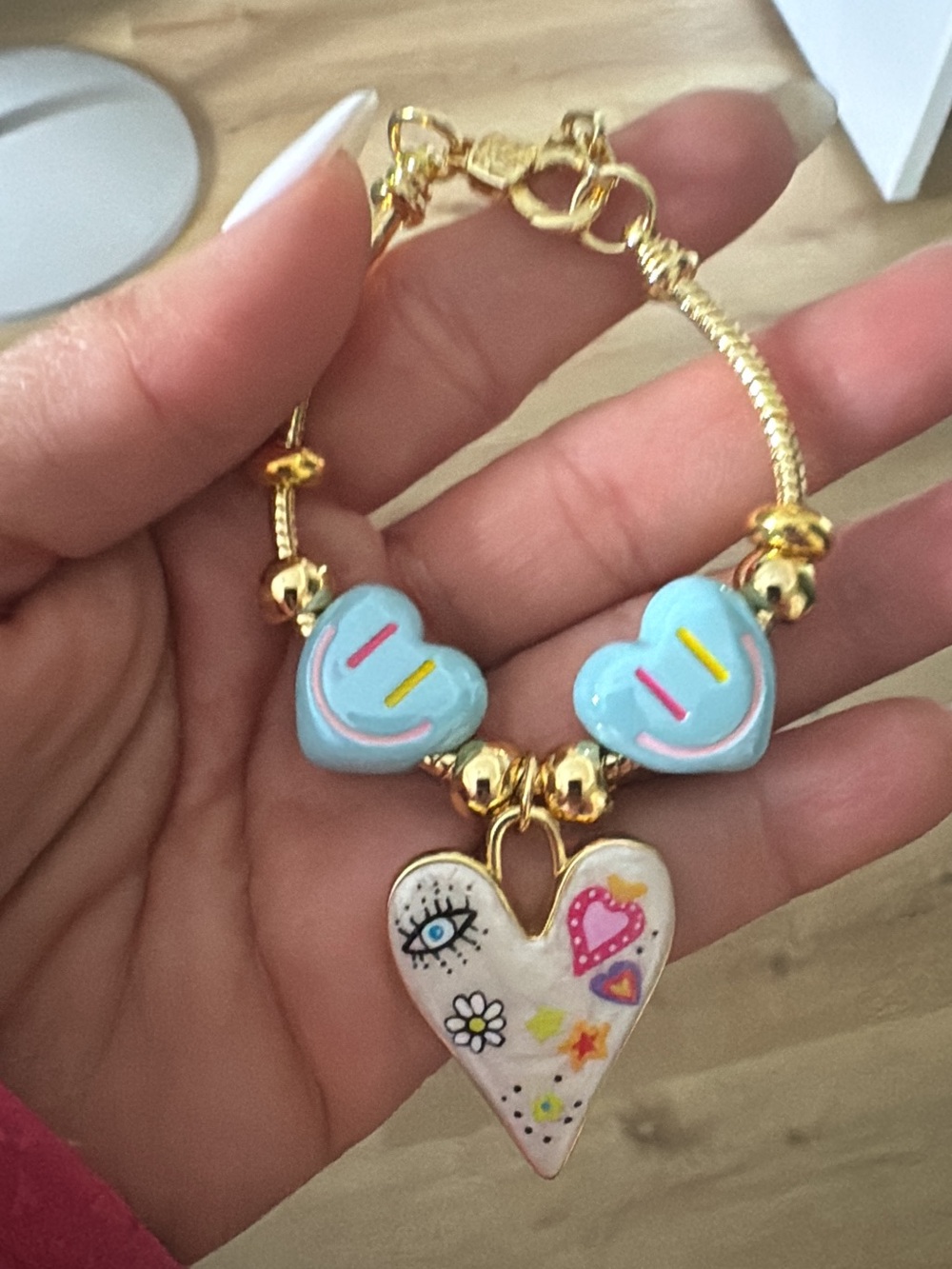 Gold-Tone Bracelet with Blue Heart Charms